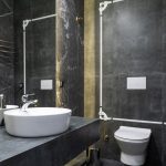 Elegant modern bathroom featuring marble walls and contemporary sink.