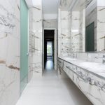Elegant marble bathroom featuring a modern double vanity design.